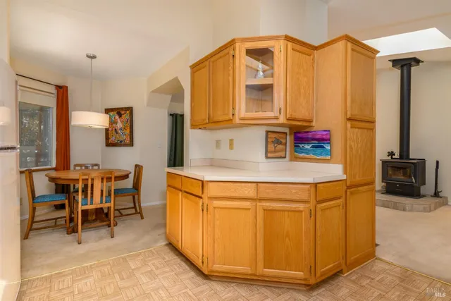 a kitchen that has a cabinets and a table in it