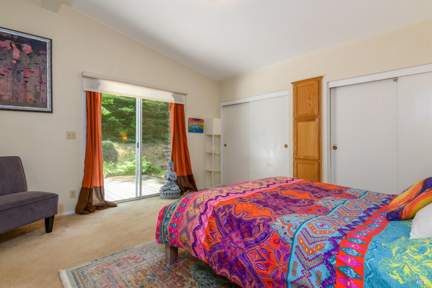 35551 Ocean View Street Gualala, CA 95445 - Photo 17 of 26 a bed sitting in a bedroom next to a window