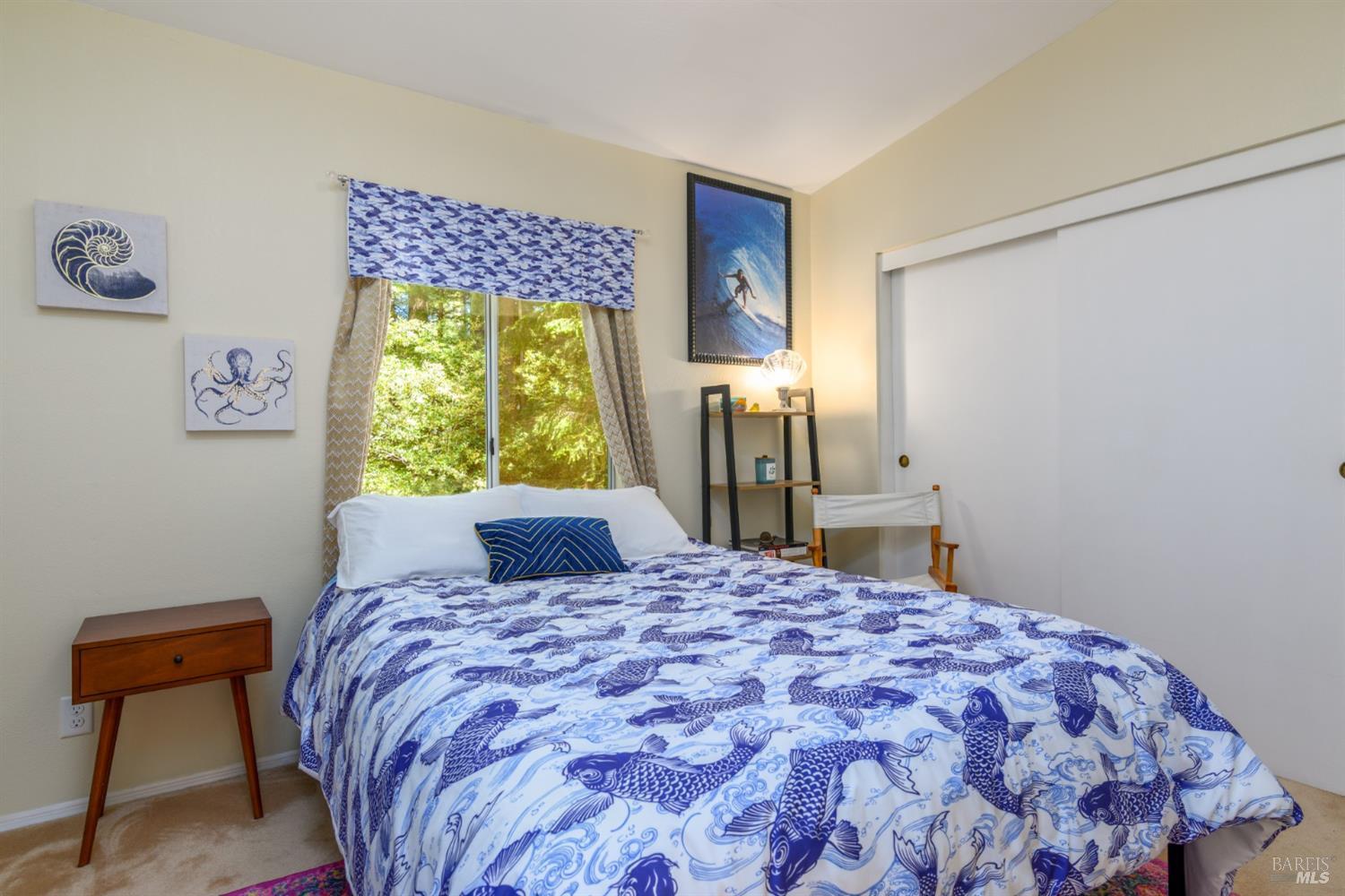 35551 Ocean View Street Gualala, CA 95445 - Photo 20 of 26 a bedroom with a bed and a window