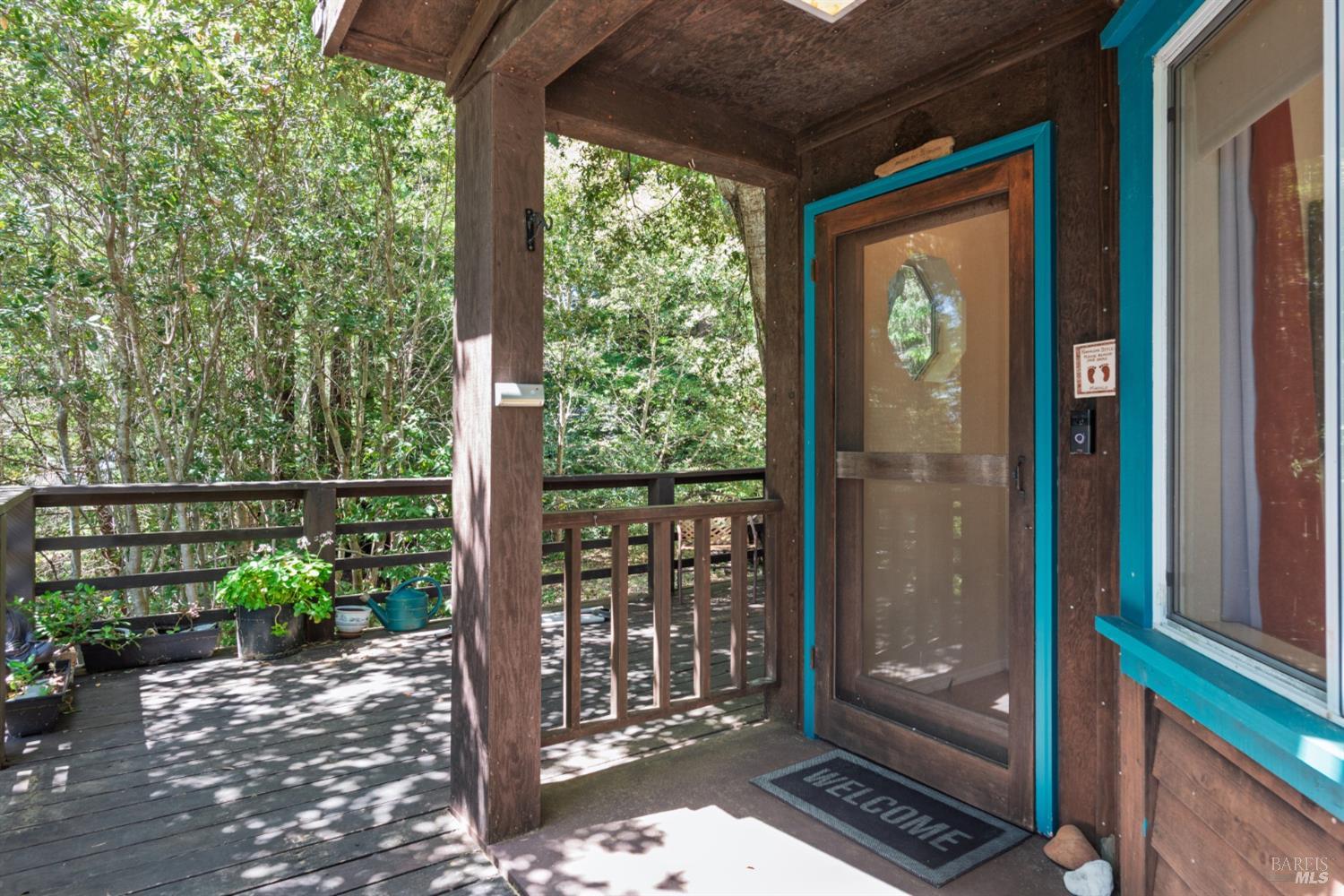 35551 Ocean View Street Gualala, CA 95445 - Photo 5 of 26 a front view of a house with a garden