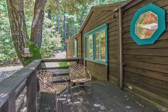 a view of a wooden bench next to a yard