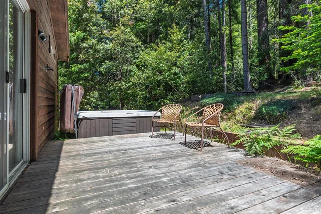 a view of a deck with two chairs and a table