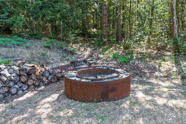 a view of a water fountain in a yard