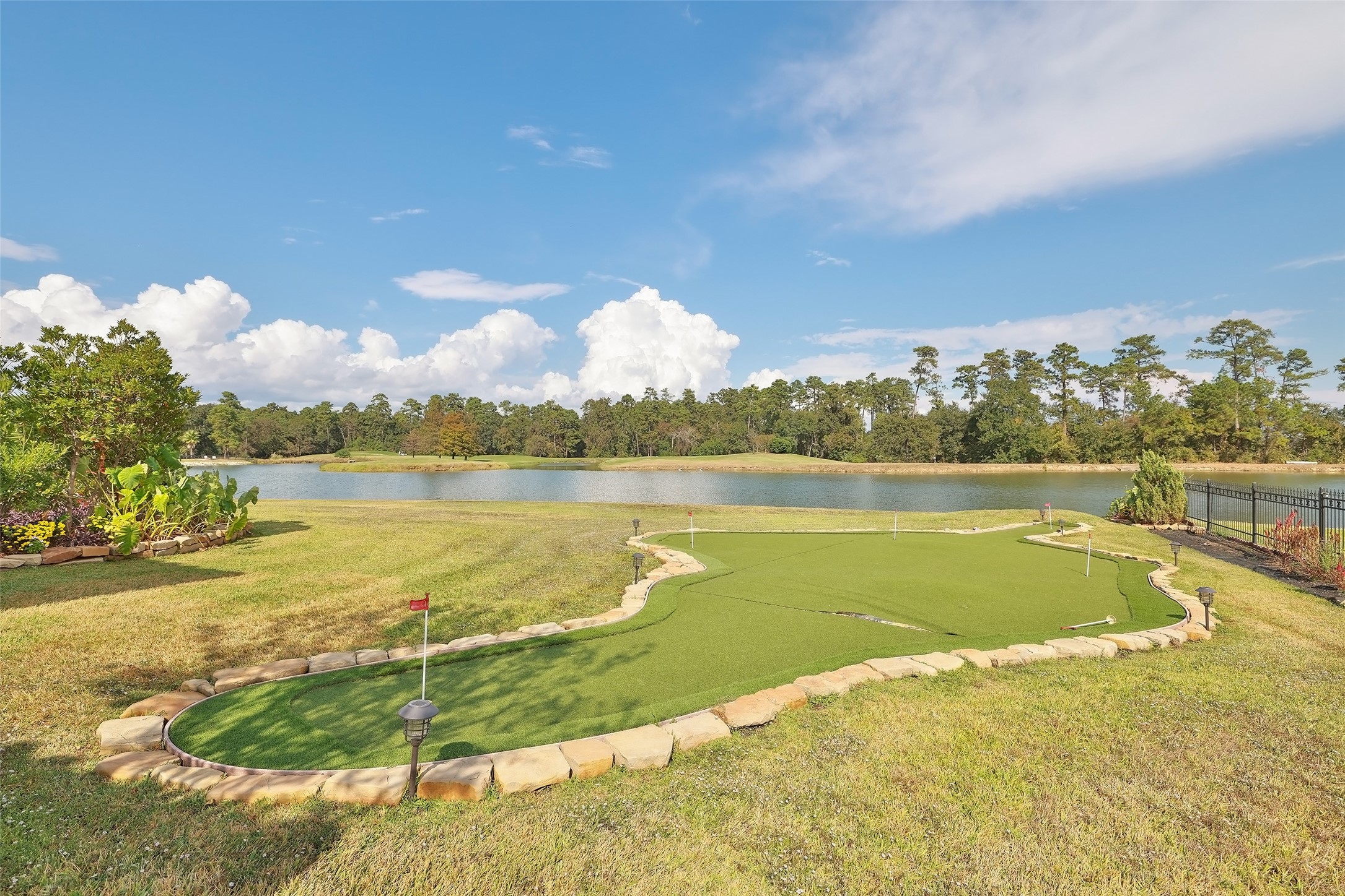 22 Post Shadow Estate Drive Spring, TX 77389 - Photo 11 of 50 a view of a lake with a big yard