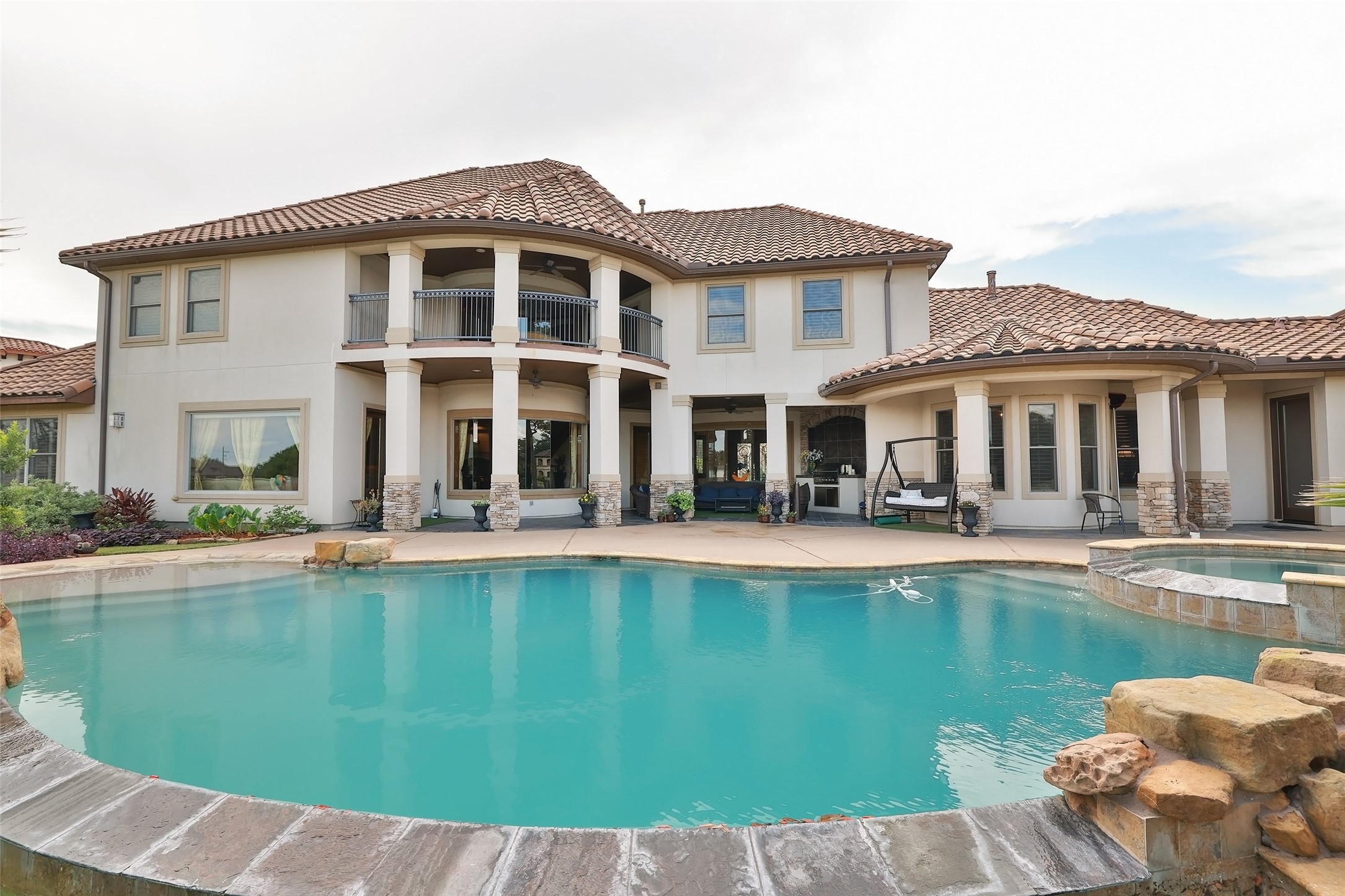 22 Post Shadow Estate Drive Spring, TX 77389 - Photo 15 of 50 a front view of a house with swimming pool having outdoor seating