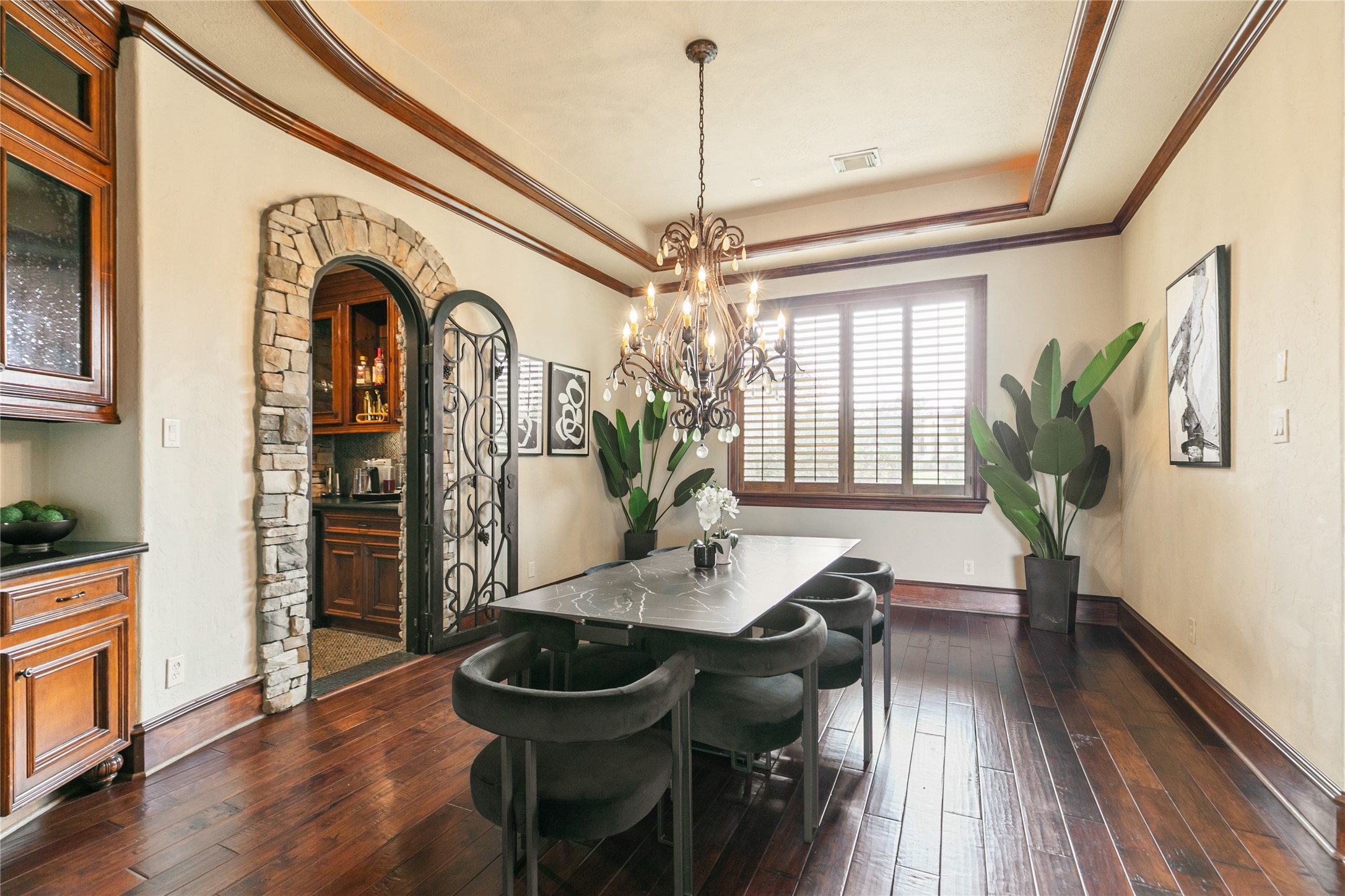 22 Post Shadow Estate Drive Spring, TX 77389 - Photo 19 of 50 Grand dining room features gorgeous chandelier within tray ceiling and lovely stone accents and built-in cabinets.