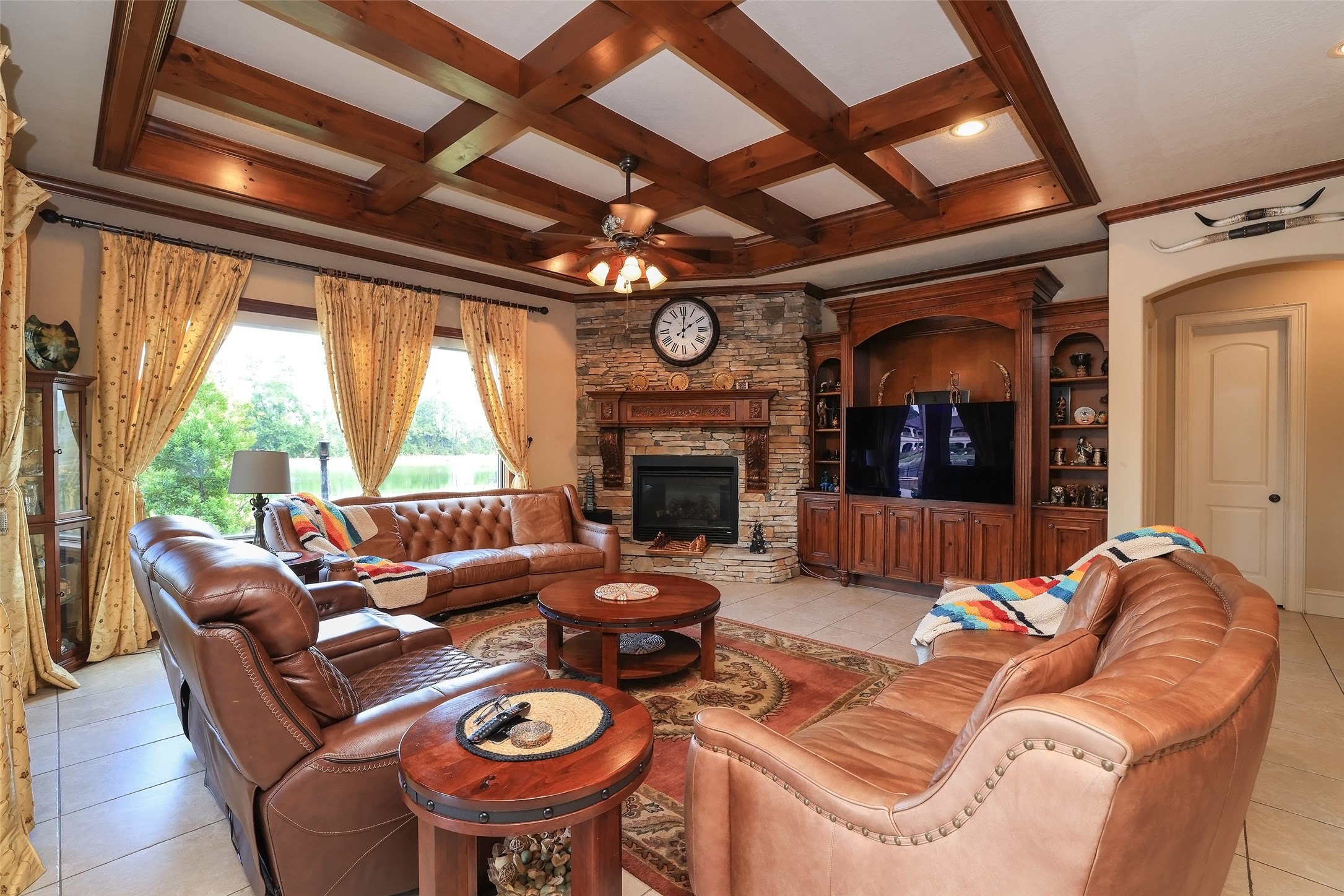 22 Post Shadow Estate Drive Spring, TX 77389 - Photo 21 of 50 a living room with furniture a fireplace and a large window