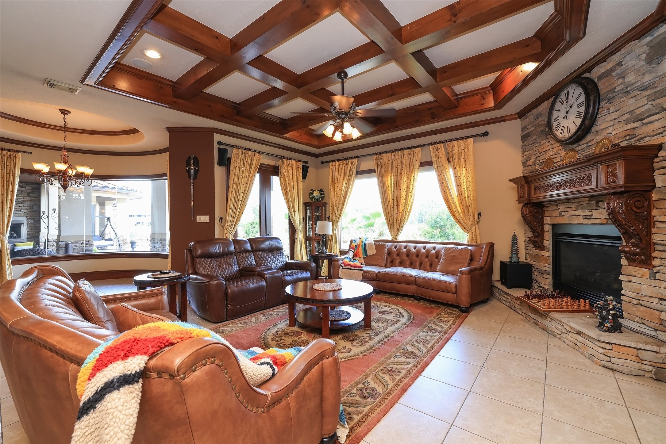 22 Post Shadow Estate Drive Spring, TX 77389 - Photo 22 of 50 a living room with furniture a fireplace and a ceiling fan