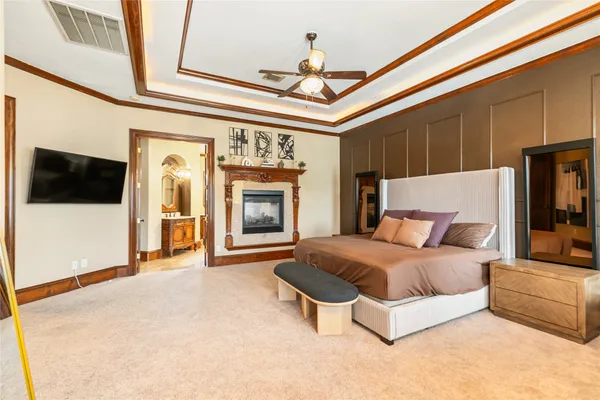 a bedroom with furniture and a fireplace