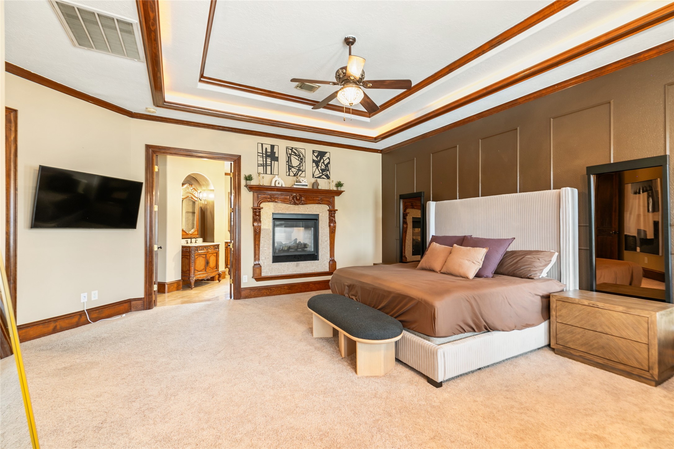 22 Post Shadow Estate Drive Spring, TX 77389 - Photo 33 of 50 This primary suite is elevated by the shared fireplace with the primary bath creating a cozy and relaxing atmosphere.