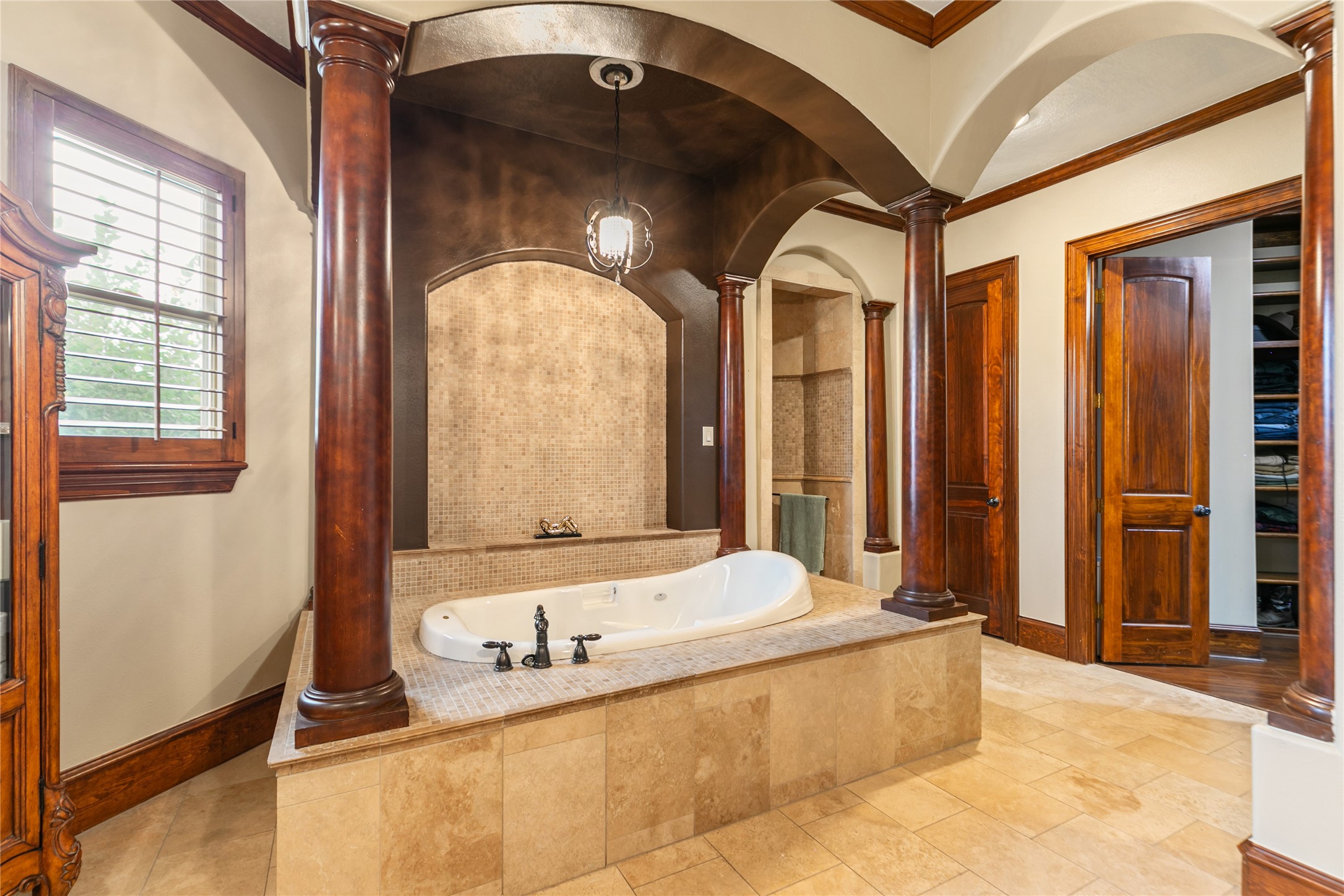 22 Post Shadow Estate Drive Spring, TX 77389 - Photo 36 of 50 The expansive primary bathroom boasts an inviting tub, perfect for relaxation and rejuvenation.
