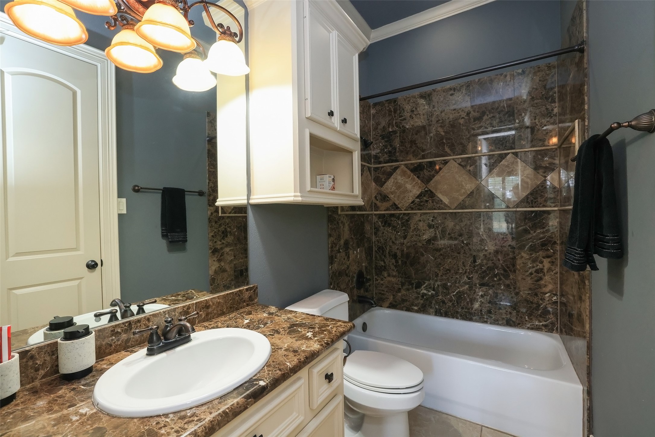 22 Post Shadow Estate Drive Spring, TX 77389 - Photo 37 of 50 a bathroom with a granite countertop sink mirror toilet and bathtub