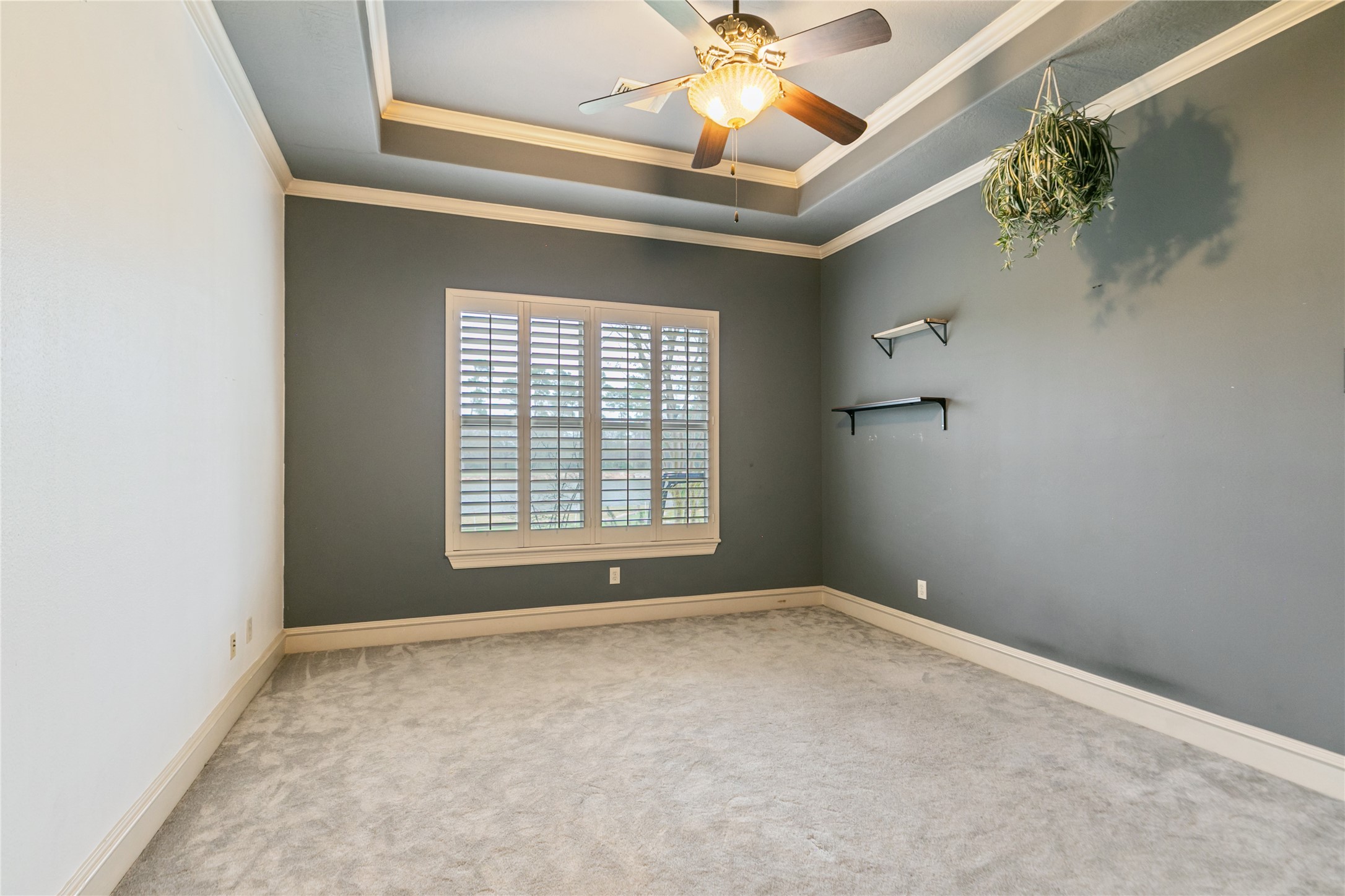 22 Post Shadow Estate Drive Spring, TX 77389 - Photo 38 of 50 Downstairs secondary bedroom with attractive tray ceiling and plantation shutters.