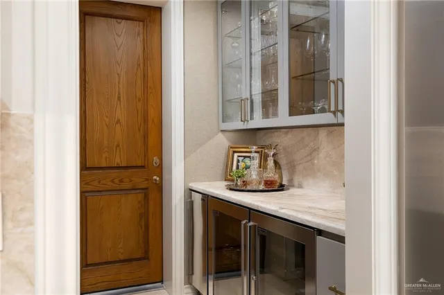 a kitchen with a sink and a refrigerator