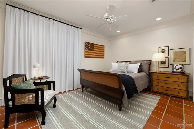 a bedroom with furniture and a window