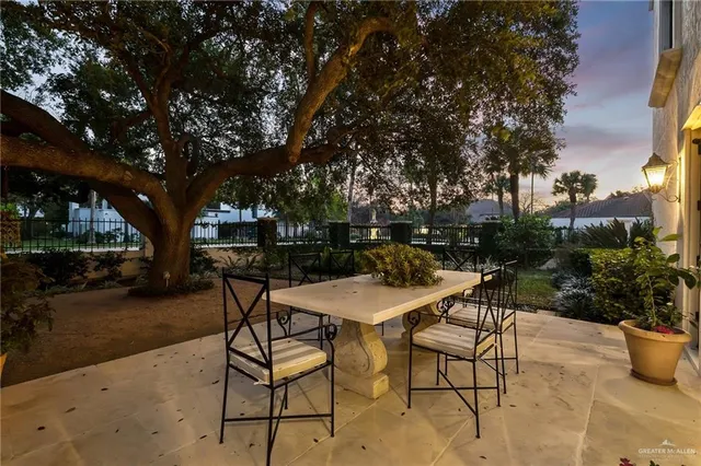a view of a backyard with sitting area