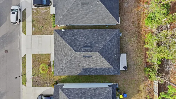 an aerial view of a house with a garden
