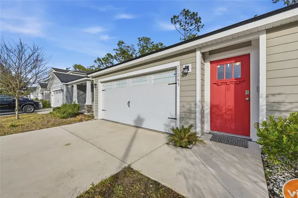 front view of a house with a small yard
