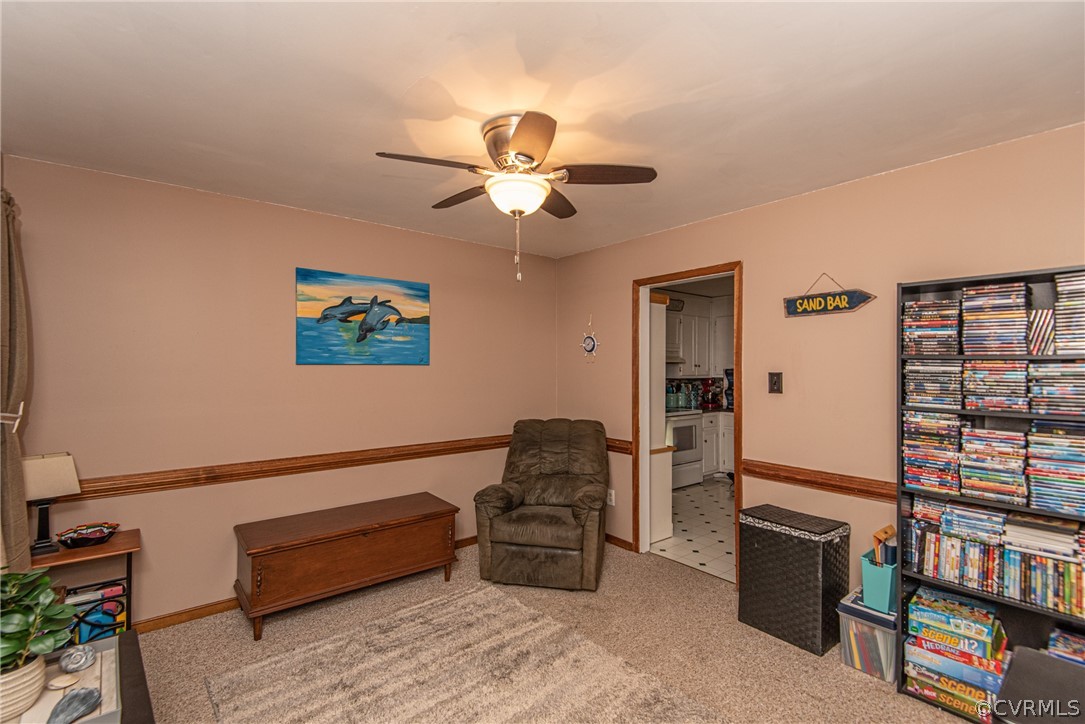 10719 Ridgerun Road Chesterfield, VA 23832 - Photo 13 of 26 a living room with furniture and a book shelf