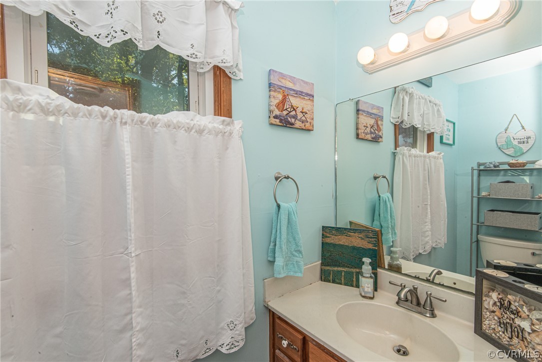 10719 Ridgerun Road Chesterfield, VA 23832 - Photo 15 of 26 a bathroom with a sink and a mirror