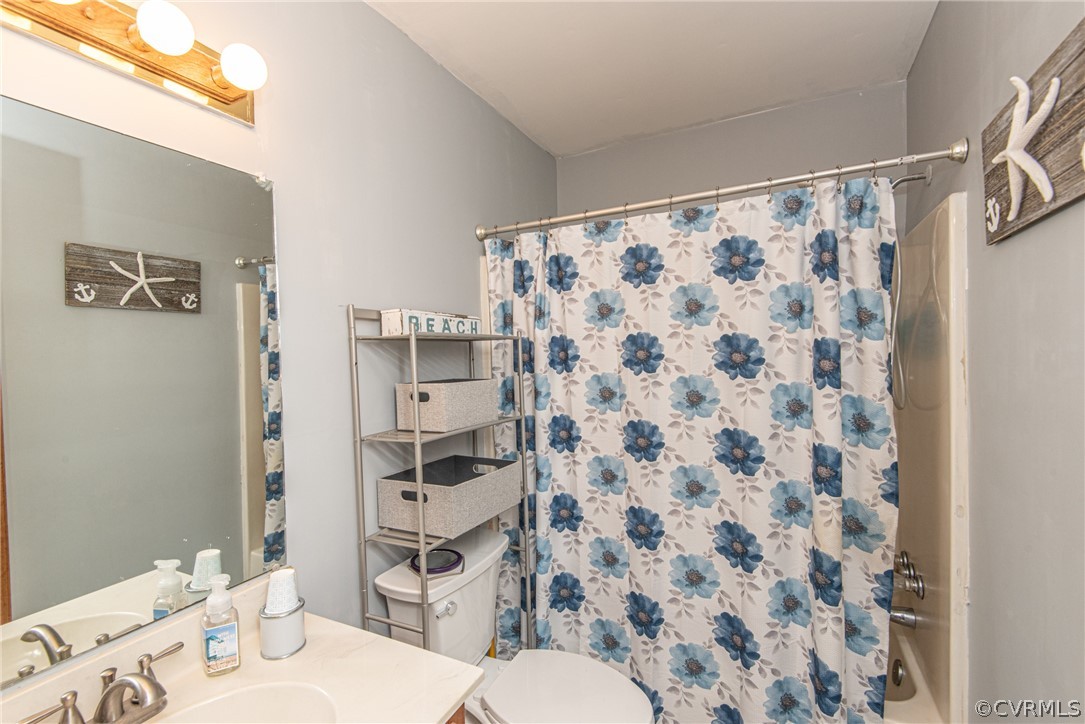 10719 Ridgerun Road Chesterfield, VA 23832 - Photo 19 of 26 a bathroom with a sink toilet and shower