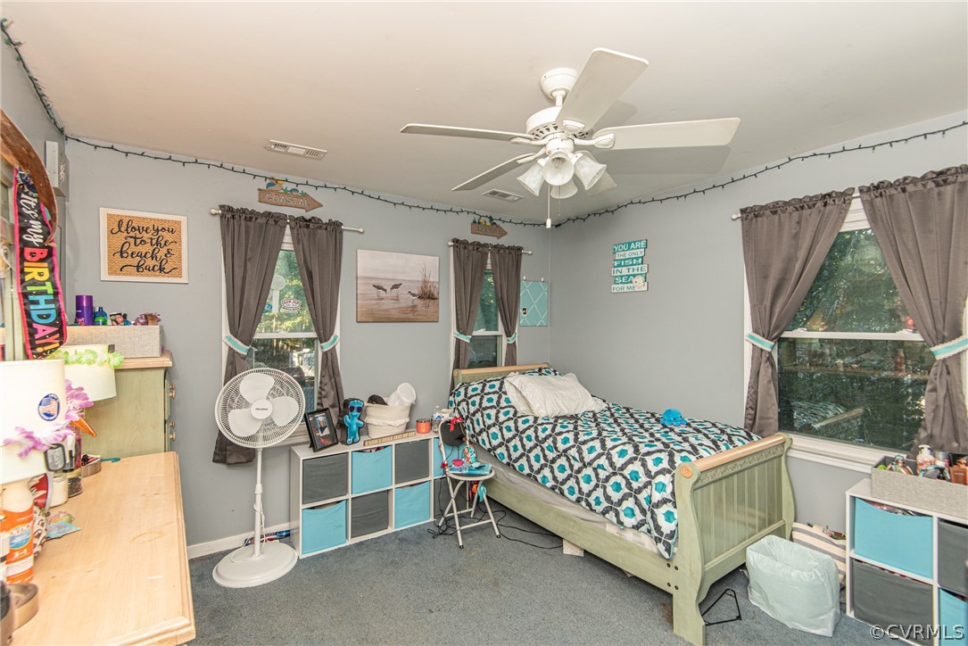 10719 Ridgerun Road Chesterfield, VA 23832 - Photo 20 of 26 a bedroom with a bed and a large window