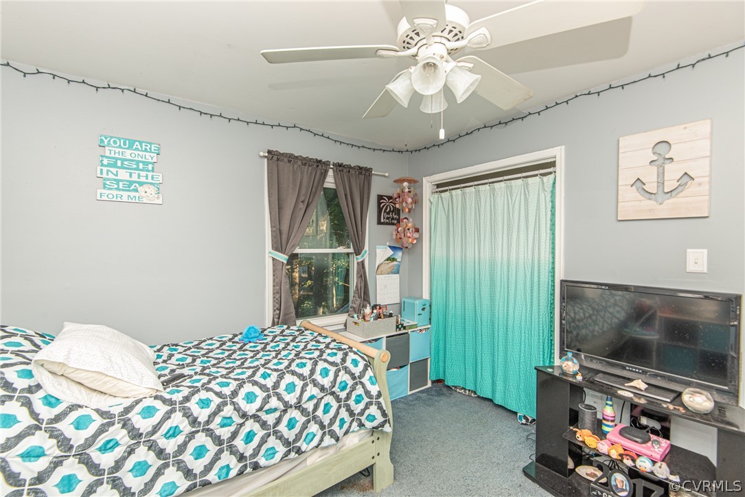 10719 Ridgerun Road Chesterfield, VA 23832 - Photo 21 of 26 a bedroom with a bed and a flat screen tv