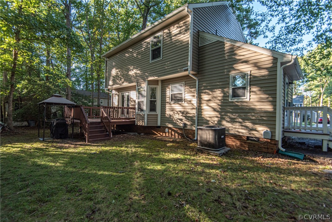 10719 Ridgerun Road Chesterfield, VA 23832 - Photo 25 of 26 a view of a house with backyard and sitting area