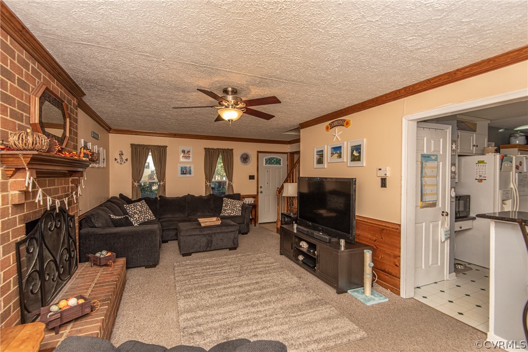 10719 Ridgerun Road Chesterfield, VA 23832 - Photo 7 of 26 a living room with furniture a chandelier and a flat screen tv