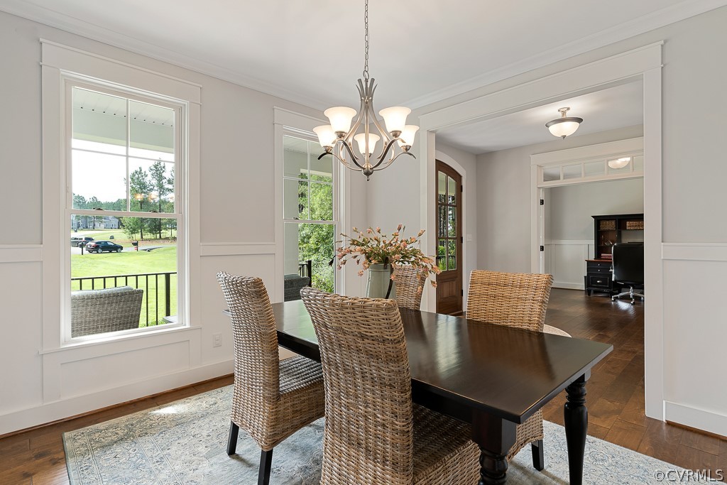 3812 Millmount Drive Powhatan, VA 23139 - Photo 11 of 48 a view of a dining room with furniture window and wooden floor