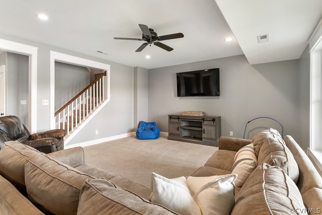 3812 Millmount Drive Powhatan, VA 23139 - Photo 34 of 48 a living room with furniture and a flat screen tv with kitchen view