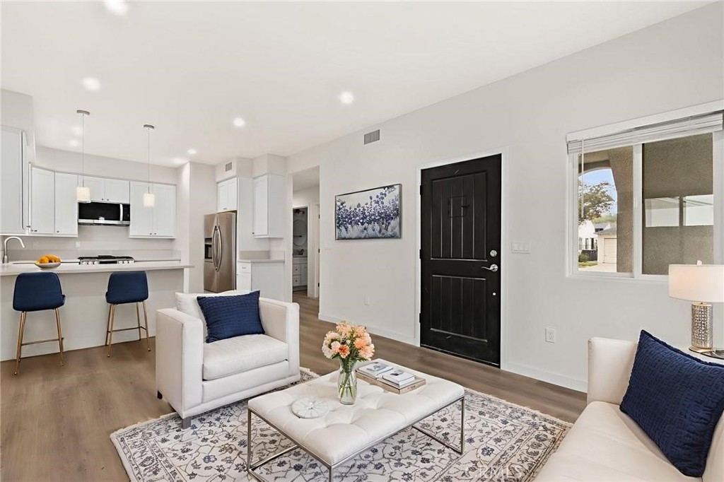 a living room with furniture and a rug