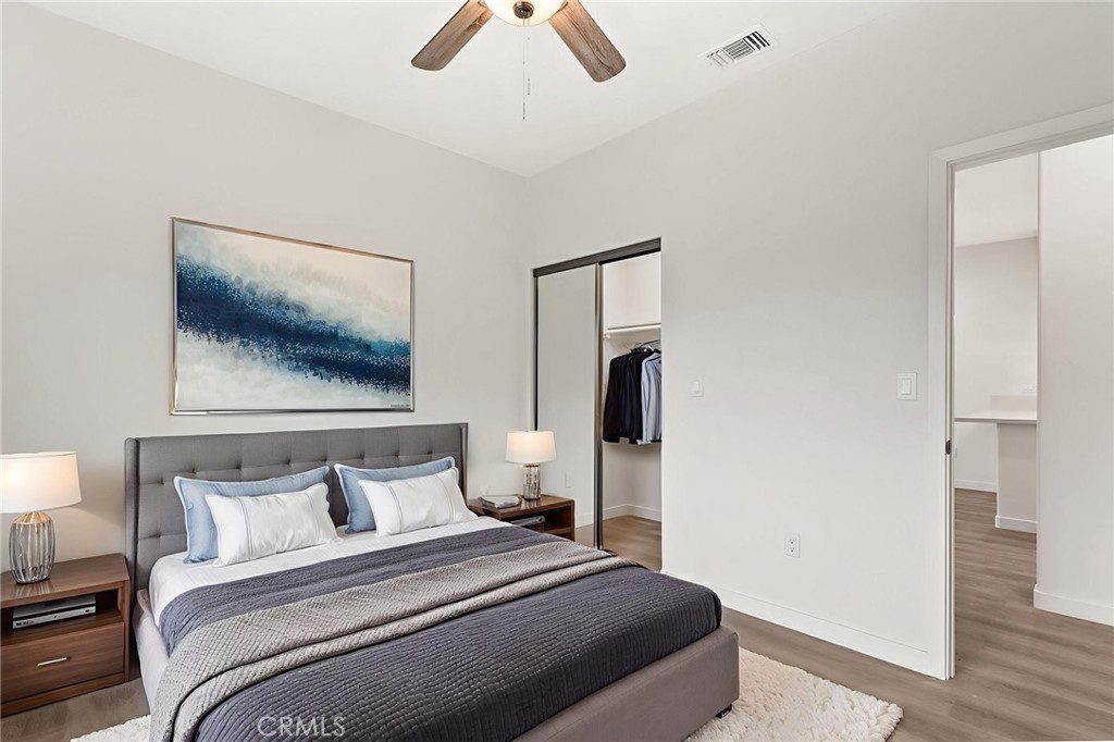4508 Hedda Street, Unit 2 Lakewood, CA 90712 - Photo 6 of 10 a bedroom with a bed and a painting on the wall