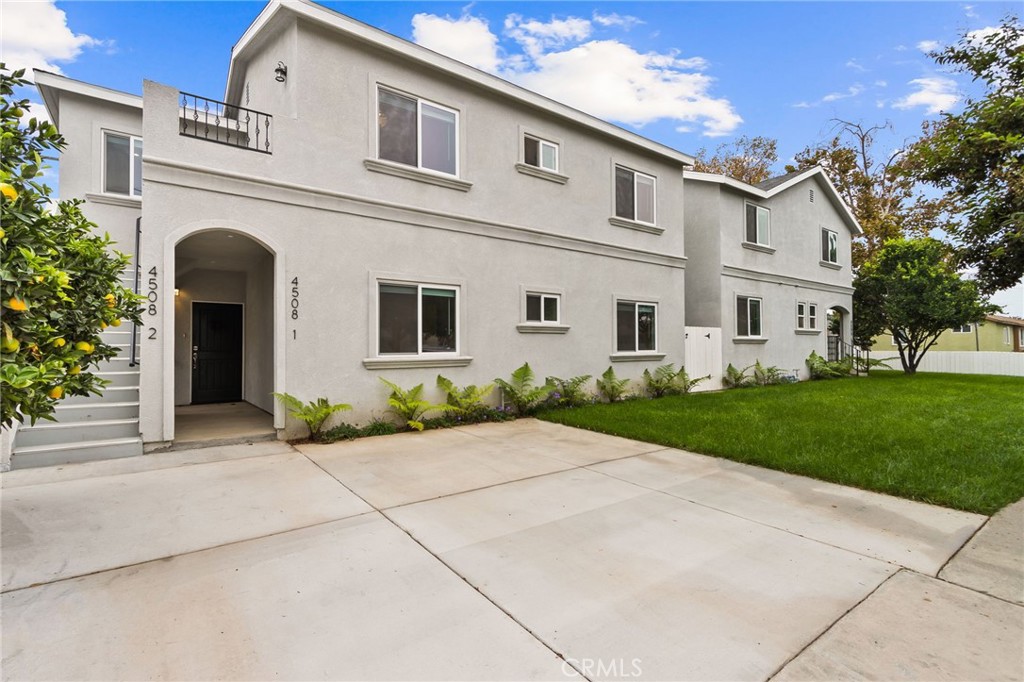 4508 Hedda Street, Unit 2 Lakewood, CA 90712 - Photo 10 of 10 a front view of house with yard