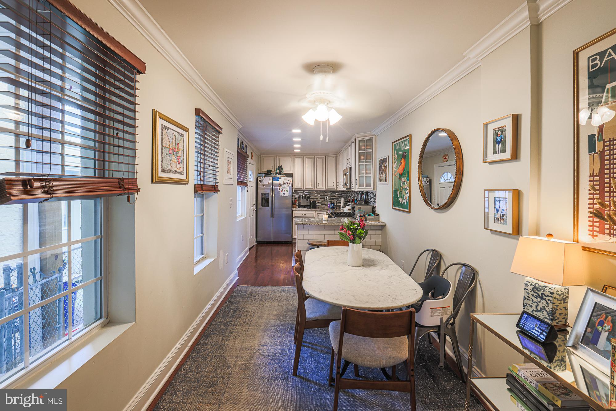 1446 Hull Street Baltimore, MD 21230 - Photo 13 of 54 a view of a dining room with furniture and a large window
