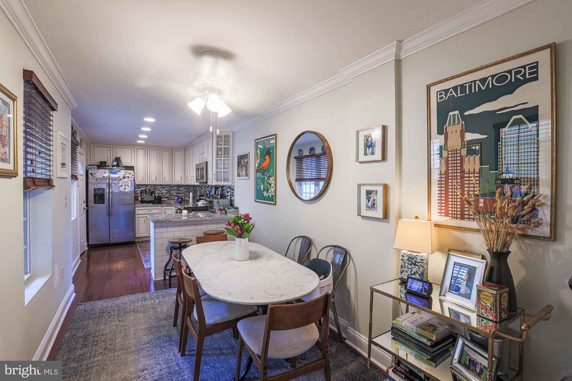 1446 Hull Street Baltimore, MD 21230 - Photo 14 of 54 a view of a dining room with furniture and a clock