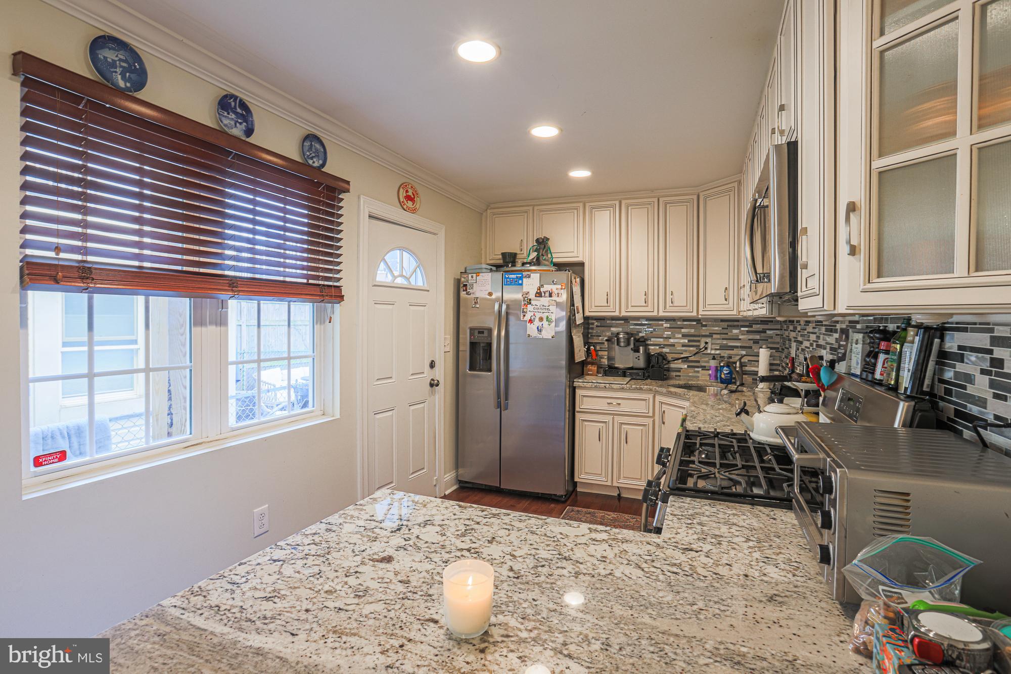 1446 Hull Street Baltimore, MD 21230 - Photo 19 of 54 a kitchen with refrigerator and window