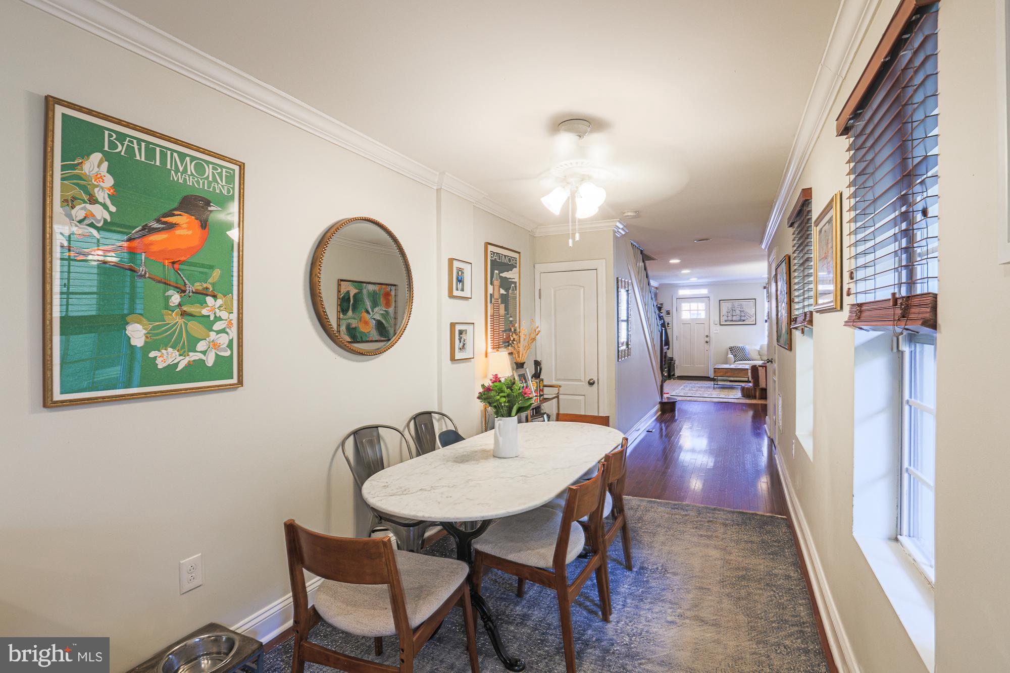 1446 Hull Street Baltimore, MD 21230 - Photo 23 of 54 a view of a dining room with furniture a rug and wooden floor