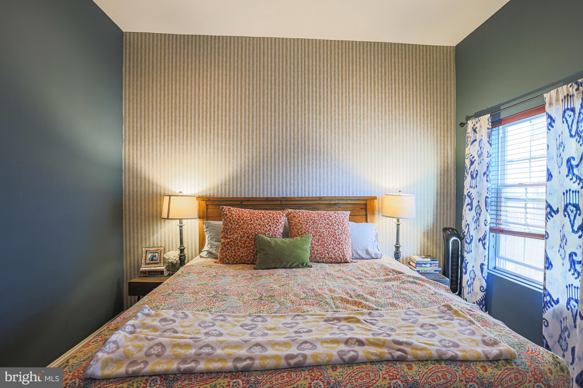 1446 Hull Street Baltimore, MD 21230 - Photo 32 of 54 a bedroom with a bed and wooden floor