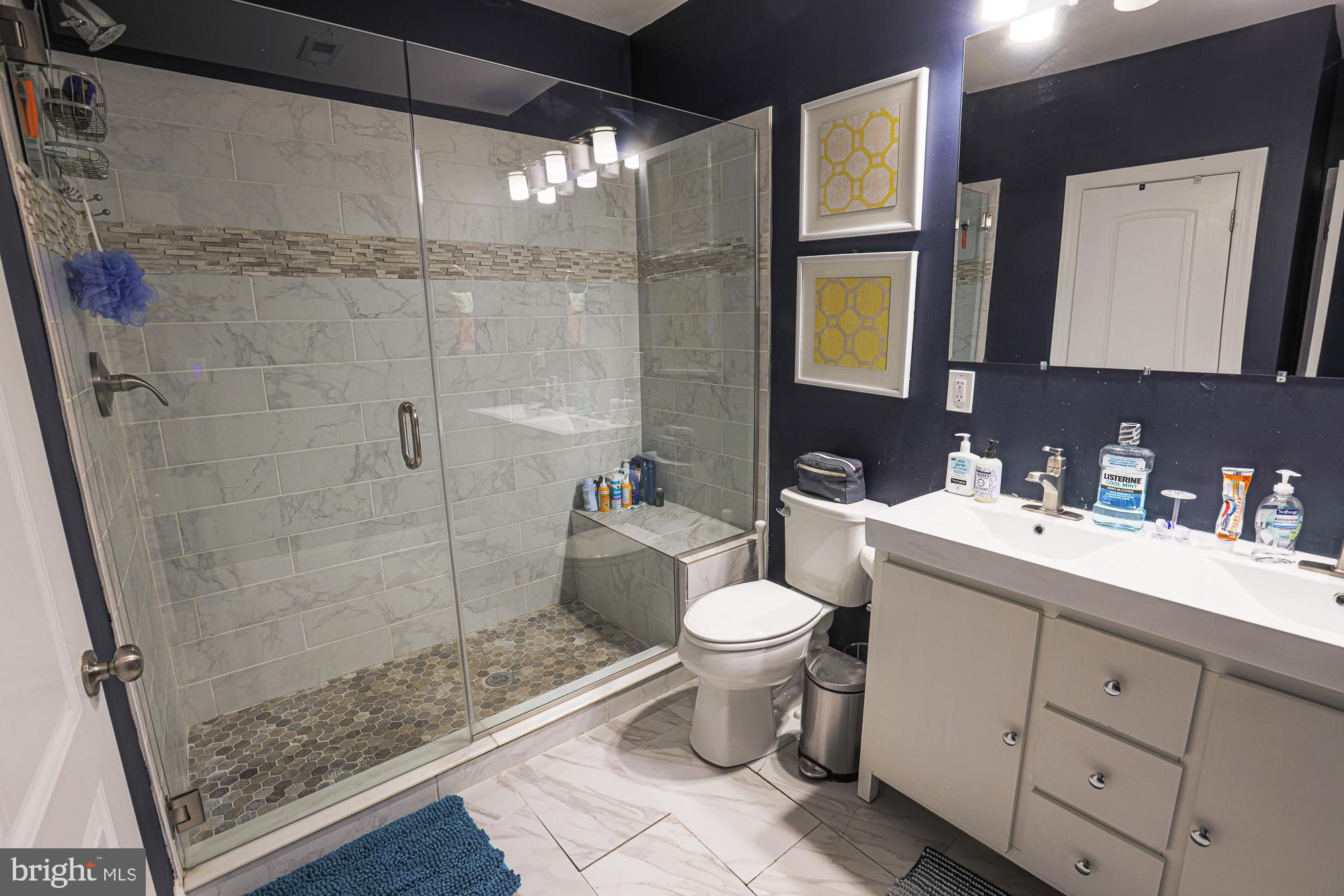 1446 Hull Street Baltimore, MD 21230 - Photo 34 of 54 a bathroom with a sink toilet and shower