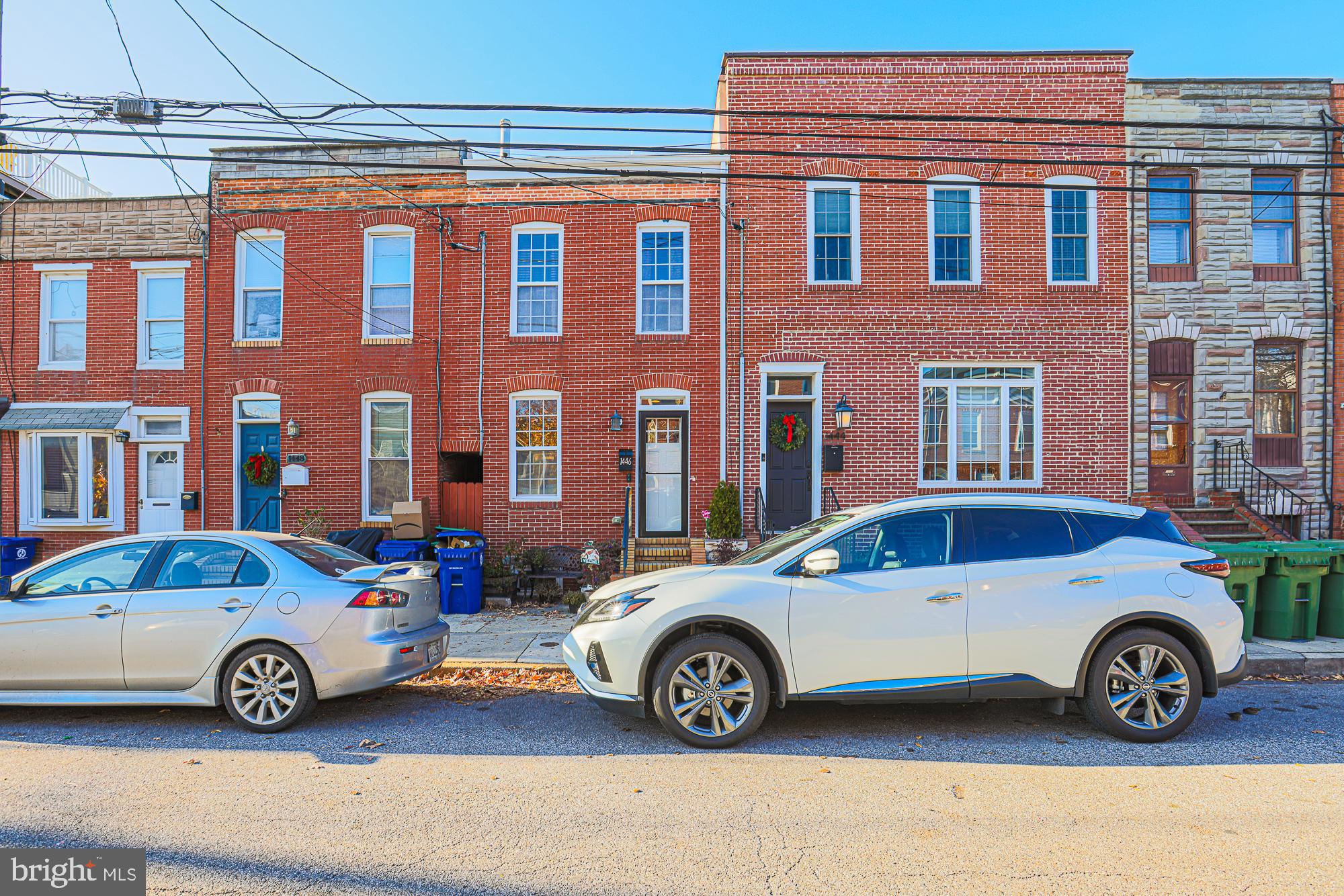 1446 Hull Street Baltimore, MD 21230 - Photo 4 of 54 a car parked in front of a house