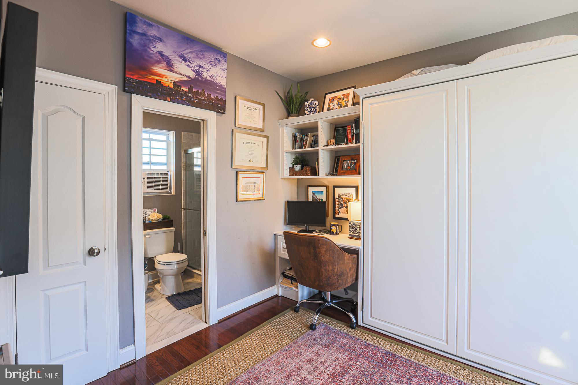 1446 Hull Street Baltimore, MD 21230 - Photo 44 of 54 a view of a workspace with furniture and wooden floor