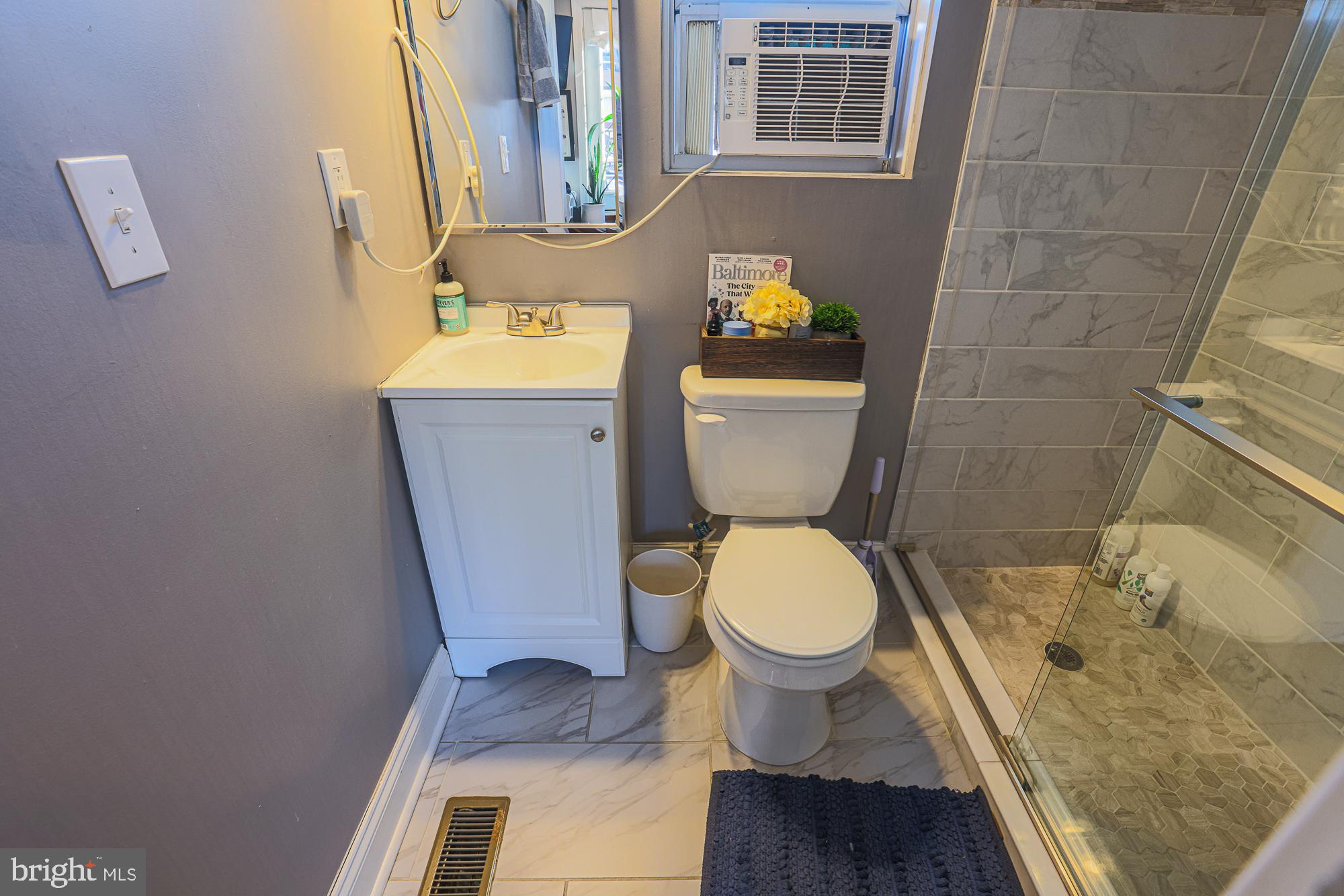 1446 Hull Street Baltimore, MD 21230 - Photo 48 of 54 a bathroom with a toilet and a sink
