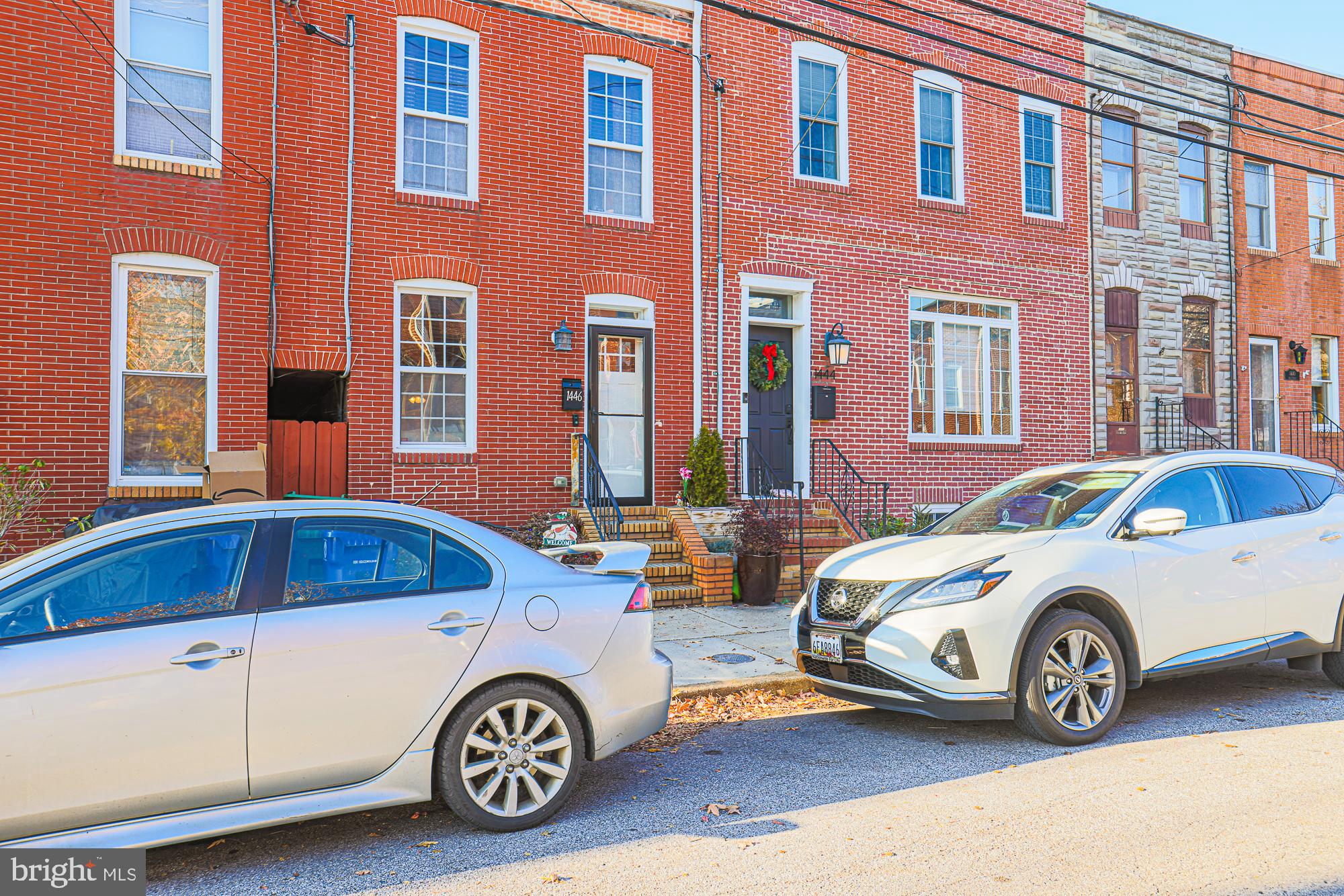 1446 Hull Street Baltimore, MD 21230 - Photo 5 of 54 a car parked in front of a house