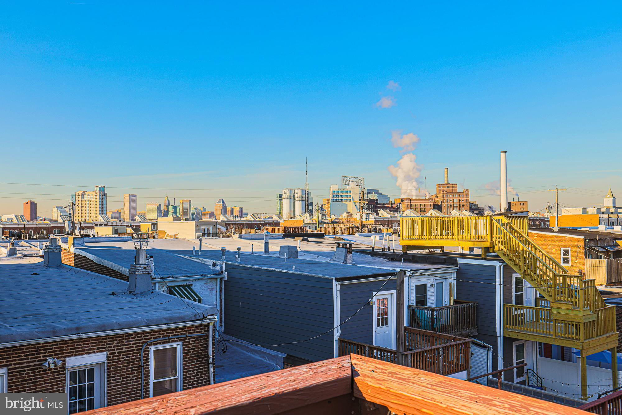 1446 Hull Street Baltimore, MD 21230 - Photo 53 of 54 a view of a rooftop with chairs and a table