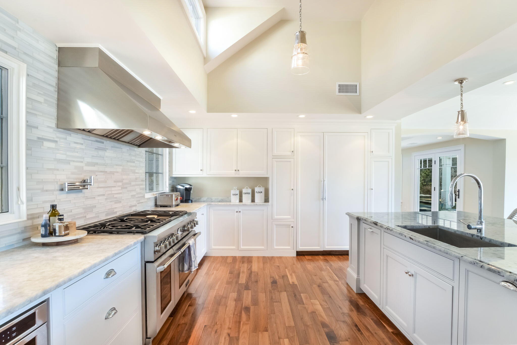 71 Sand Point Osterville, MA 02655 - Photo 24 of 45 a kitchen with granite countertop a sink stove and cabinets