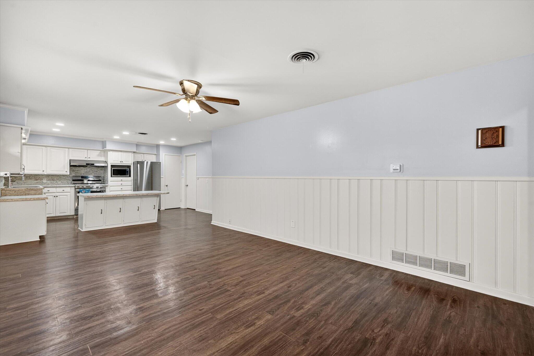 4915 17th Street Lubbock, TX 79416 - Photo 18 of 29 a view of kitchen with cabinets and wooden floor