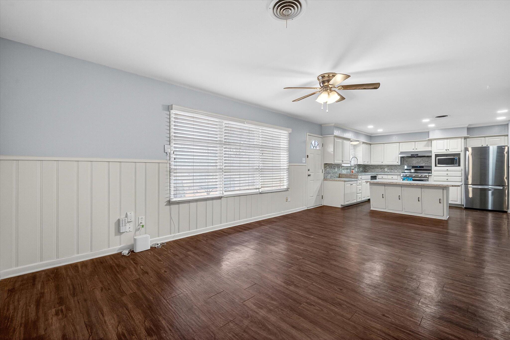 4915 17th Street Lubbock, TX 79416 - Photo 19 of 29 a view of an empty room with window and wooden floor