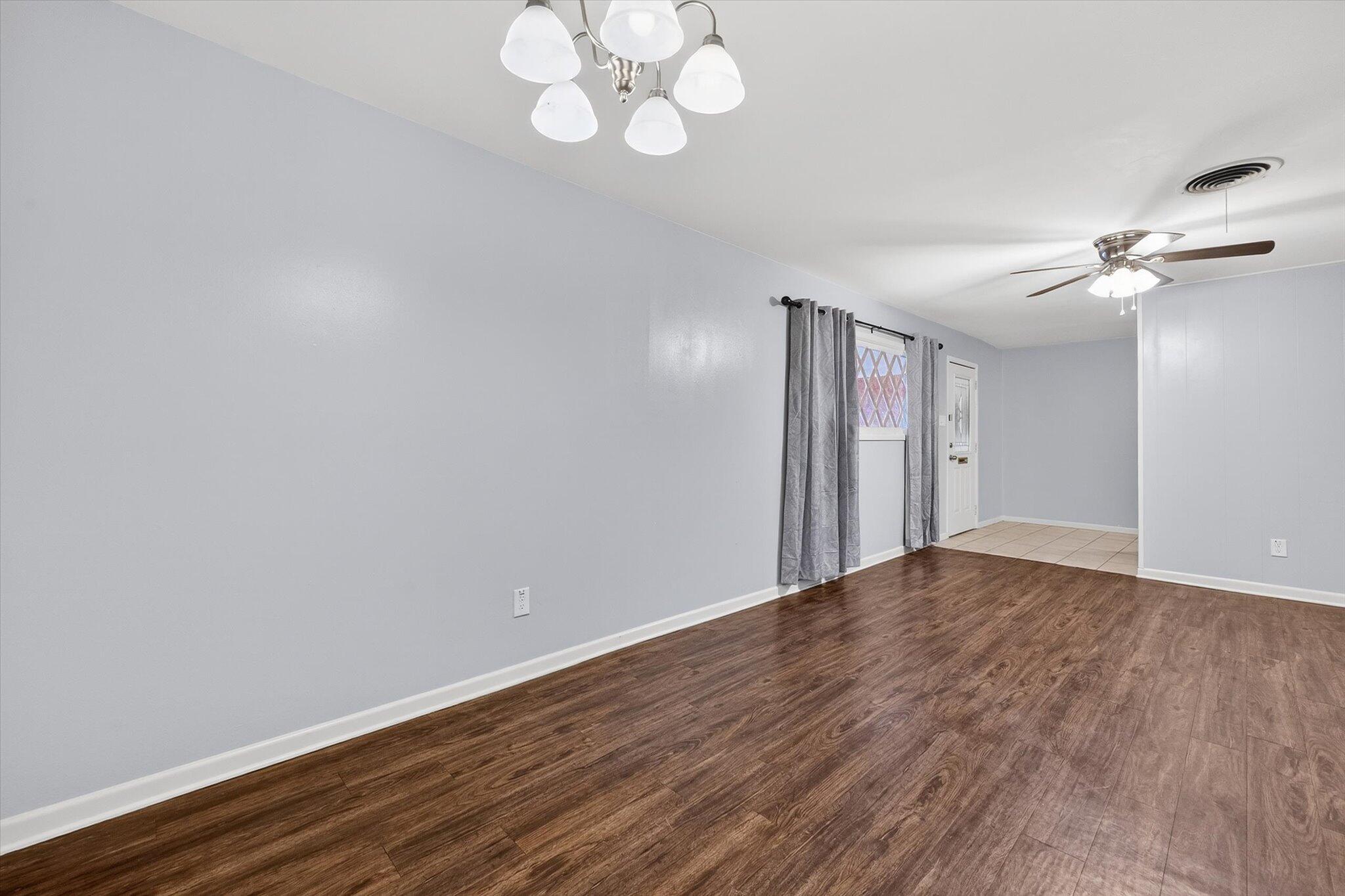 4915 17th Street Lubbock, TX 79416 - Photo 21 of 29 an empty room with wooden floor and fan
