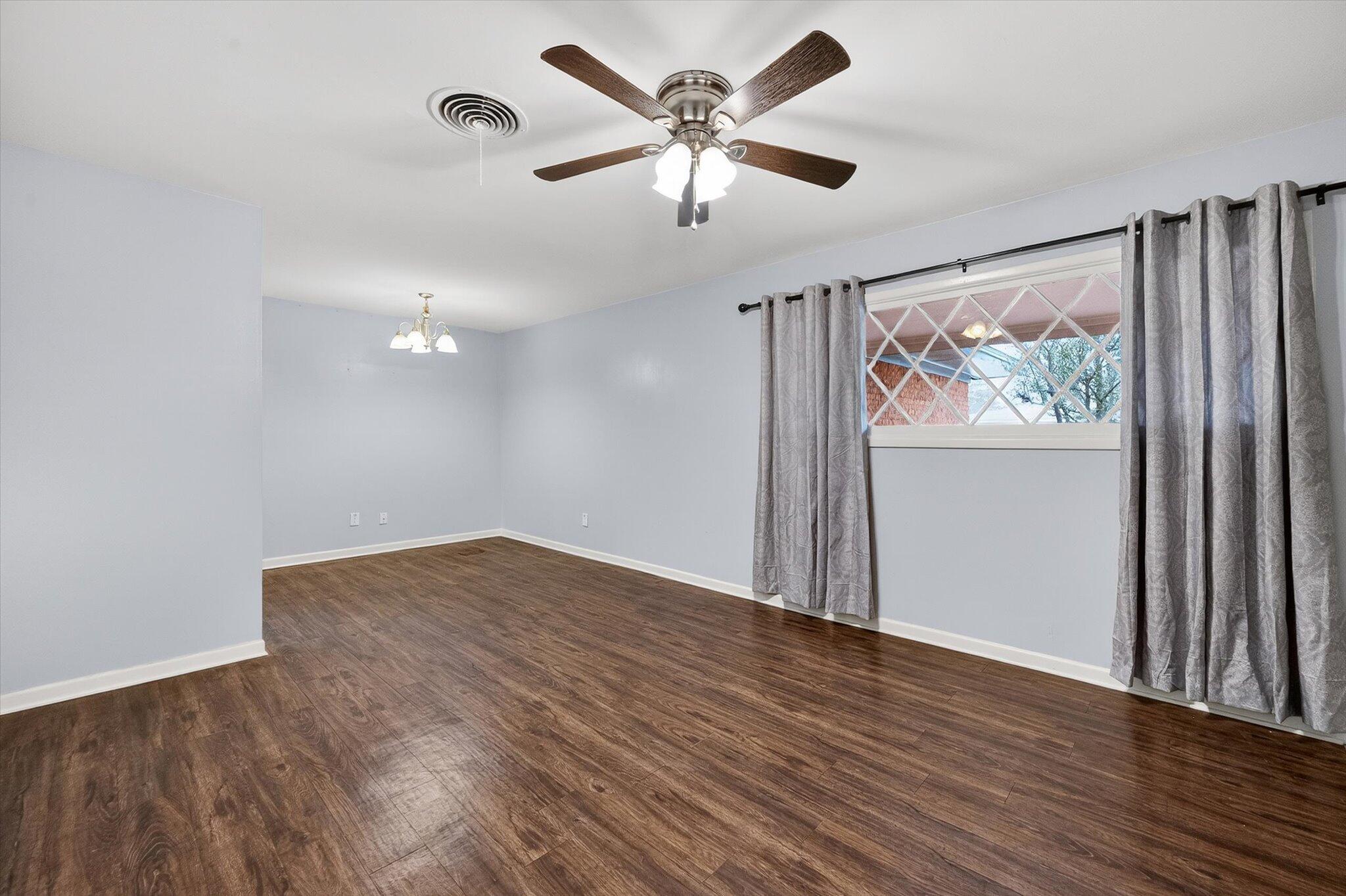 4915 17th Street Lubbock, TX 79416 - Photo 23 of 29 wooden floor in an empty room with a window